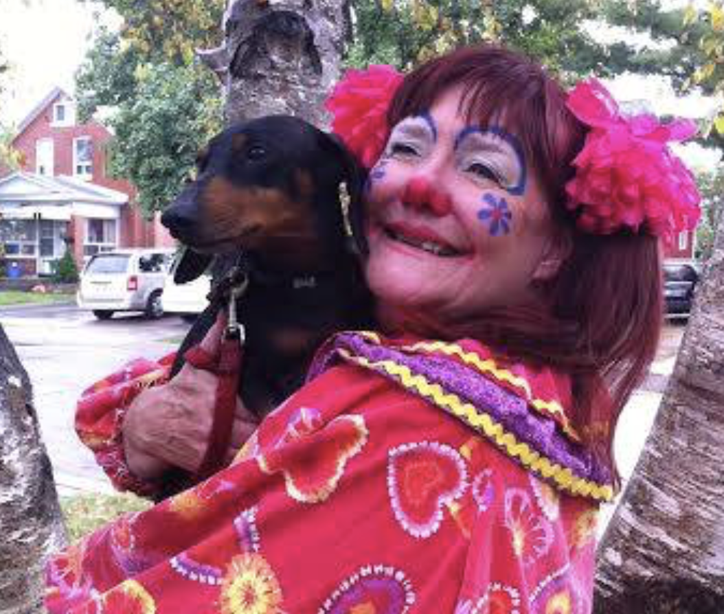 Beverley Parrish as Petunia the Clown with a dog